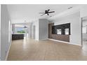 Bright, open living area with modern accents and neutral tile flooring at 10108 36Th E Ct, Parrish, FL 34219
