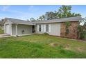 Charming single-story home with a combination of stone facade and landscaped yard at 12280 Waco St, Spring Hill, FL 34609