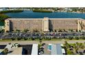 Condo exterior features a well-maintained building with ample parking at 1847 Shore Drive South # 308, South Pasadena, FL 33707