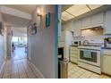 Efficient kitchen features classic white appliances and cabinetry at 1847 Shore Drive South # 308, South Pasadena, FL 33707