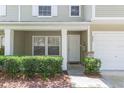 Close up front door and porch with charming landscaping and stone accents at 220 Sawtooth Dr, Valrico, FL 33594