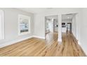 Bright living room boasts gleaming hardwood floors and abundant natural light, flowing into kitchen at 2920 E 20Th Ave, Tampa, FL 33605