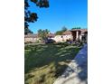 Home featuring a well-kept lawn and minimalist landscaping with a sidewalk leading to the entrance at 1061 6Th Nw St, Largo, FL 33770