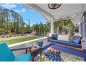 Inviting front porch with a cozy swing and comfortable seating area at 145 19Th Se Ave, St Petersburg, FL 33705