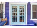 Beautiful blue front porch doors with glass panes at 145 19Th Se Ave, St Petersburg, FL 33705