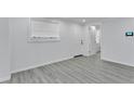 Bright living room featuring neutral paint and modern flooring at 2107 E 93Rd Ave, Tampa, FL 33612