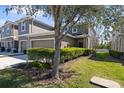 Charming two-story townhome featuring an attached garage and well-maintained lawn at 2221 Broadway View Ave, Brandon, FL 33510
