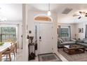 Welcoming home entrance with a decorative front door, tile flooring, and an open view into the living spaces at 5253 1St N Ave, St Petersburg, FL 33710