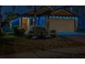 Exterior view of well maintained home at night with decorative holiday lighting at 10222 Cool Waterlily Ave, Riverview, FL 33578