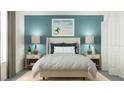 Stylish bedroom features neutral walls, a cozy bed, and coordinated nightstands at 11864 Blue Diamond Trl, Parrish, FL 34219