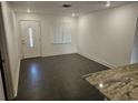 Bright living room with stylish tiled floors and an ornate front door at 1204 23Rd W Ave, Palmetto, FL 34221