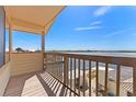Covered balcony offers tranquil waterfront views and fresh air at 13514 Garris Dr, Hudson, FL 34667
