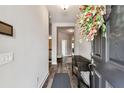 Elegant entryway with wood floors, complemented by decorative accents and a welcoming atmosphere at 19370 Hawk Valley Dr, Tampa, FL 33647