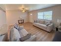 Bright and airy living room featuring wood-look floors and modern decor at 205 Andover N Pl # 110, Sun City Center, FL 33573