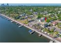 Beautiful aerial view of waterfront property with lush landscaping and nearby marina at 2827 1St Ne St, St Petersburg, FL 33704