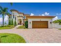 Expansive house view, showing the garage and front entrance with the driveway from the street at 362 41St Ave, St Pete Beach, FL 33706