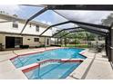 Inviting screened-in pool with a spacious deck, perfect for outdoor entertaining and relaxation at 3802 Cloverhill Ct, Brandon, FL 33511