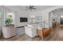 Cozy living room with light colors, modern furniture, and hardwood floors at 4777 Ballantrae Blvd, Land O Lakes, FL 34638