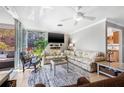 Comfortable living room with tile floors, ceiling fan, sliding doors and exterior view at 615 10Th Ne Ave # 1, St Petersburg, FL 33701