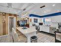 Spacious kitchen featuring a breakfast bar, stainless steel appliances, and bright blue accent wall at 753 Almeda N St, St Petersburg, FL 33702