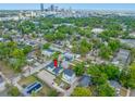 An aerial view showcasing the property's location within a vibrant city neighborhood, surrounded by lush trees and city skyline at 1030 11Th S Ave, St Petersburg, FL 33705