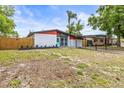 Well-maintained single Gathering home with front lawn and carport at 10909 N Lantana Ave, Tampa, FL 33612
