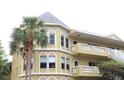 The three-story condo building has arched windows and quaint balconies at 2221 Norwegian Dr # 43, Clearwater, FL 33763