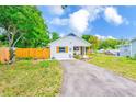 Bright one-story home featuring a driveway, fenced yard, and inviting curb appeal at 3435 40Th N St, St Petersburg, FL 33713