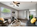 Bright and airy living room featuring stylish furnishings, light wood floors and ample natural light at 4127 13Th S Ave, St Petersburg, FL 33711