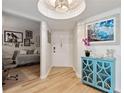 Inviting entryway with unique lighting, blue accents, and open access to the living spaces at 5279 Isla Key S Blvd # 212, St Petersburg, FL 33715