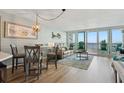 Cozy living room with comfortable seating, stylish decor, and access to a scenic balcony at 5279 Isla Key S Blvd # 212, St Petersburg, FL 33715