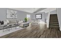 Open-concept living and dining area with wood-look flooring and modern decor at 11831 Lancashire Dr, Tampa, FL 33626