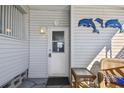 Welcoming entryway with a charming door and cozy outdoor seating area at 13225 101St St # 107, Largo, FL 33773