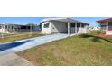 Cozy single-story home with a covered carport, offering comfortable living at 13225 101St St # 107, Largo, FL 33773