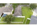Aerial view of the property showcasing lush backyard, providing ample space for Gathering enjoyment at 18150 Leamington Ln, Land O Lakes, FL 34638