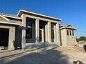 Exterior shot of building under construction with prominent windows, front door, and neutral color palette at 440 Green Dolphin S Dr, Placida, FL 33946