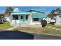 Charming single-story home featuring a quaint porch and a freshly painted door at 4851 W Gandy Blvd # B2L11, Tampa, FL 33611