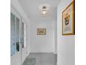 Bright and welcoming entryway featuring modern decor and ample natural light at 8258 Forest Cir, Seminole, FL 33776