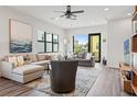 Bright living room with modern furnishings, large windows, and an open floor plan at 907 Arlington N Ave, St Petersburg, FL 33705