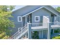 Condo complex with stairs to the units, manicured landscaping and a natural setting at 11868 Skylake Pl # 11767, Temple Terrace, FL 33617