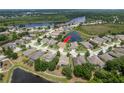 Lovely single-Gathering home surrounded by lush landscaping, ponds and mature trees in a serene residential neighborhood at 19123 Sunset Bay Dr, Land O Lakes, FL 34638
