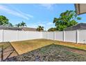 Expansive backyard enclosed by a pristine white privacy fence at 3051 Egret Ter, Safety Harbor, FL 34695