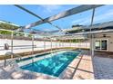 Sparkling in-ground screened pool with patio area, perfect for outdoor enjoyment at 3051 Egret Ter, Safety Harbor, FL 34695