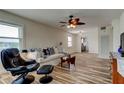 Cozy living room featuring a ceiling fan, neutral paint, comfortable seating, and wood-look floors at 5876 21St N St # 10, St Petersburg, FL 33714