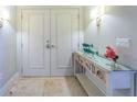 Elegant condo entryway featuring travertine floors, tasteful decor, and stylish lighting fixtures at 1350 Gulf Blvd # 502, Clearwater Beach, FL 33767