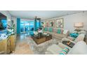 Inviting living room with stunning ocean views, comfortable seating, and stylish decor at 1350 Gulf Blvd # 502, Clearwater Beach, FL 33767