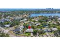 Stunning aerial view of neighborhood showcasing waterfront access and serene residential streets at 1508 Eden Isle Ne Blvd, St Petersburg, FL 33704