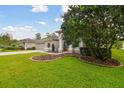 Charming home exterior boasting lush landscaping and inviting curb appeal at 2159 Warwick Dr, Oldsmar, FL 34677