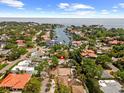 Aerial view of neighborhood with waterfront access, showcasing numerous canals, waterways, and surrounding residences marked with a red pin at 219 Rialto Ne Way, St Petersburg, FL 33704
