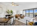 Stylish living room featuring a comfortable leather sofa, chic decor, and expansive windows offering scenic views at 5950 Pelican Bay S Plz # 603, Gulfport, FL 33707